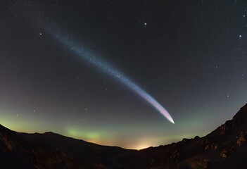 shooting star with a long glowing tail crosses the tranquil night sky, illuminating silent darkness.
