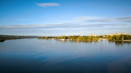 landscape by the Danube river in Novi Sad in autumn, with clouds reflected in the water