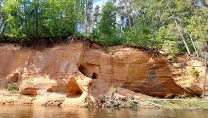 Cliffs at the river side in summer day