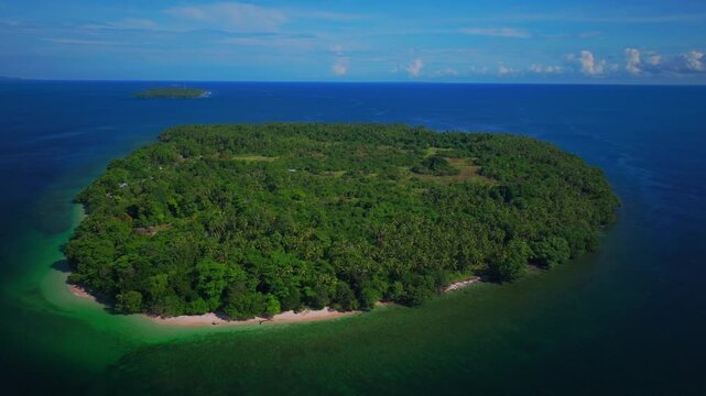 Yuo Island remote pristine beach untouched tropical Mushi island coastline village Wewak Madang Cape Wom Papua New Guinea aerial drone PNG dry season summer morning blue sky circle left up pan