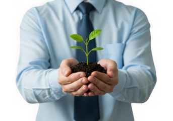 Businessman holding a small plant in his hands symbolizing growth and new beginnings