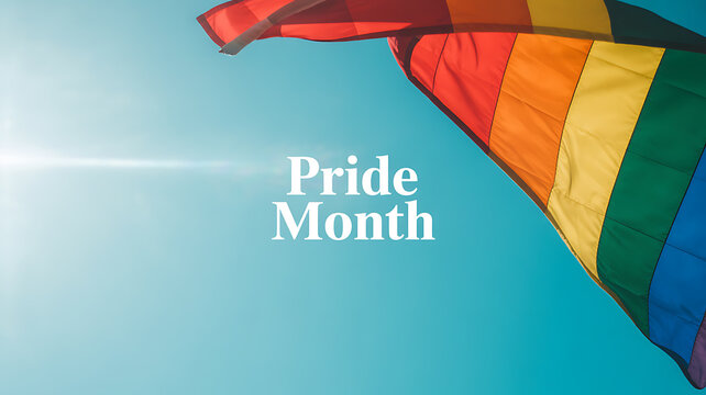 Rainbow flag waving in the sky during Pride Month celebration