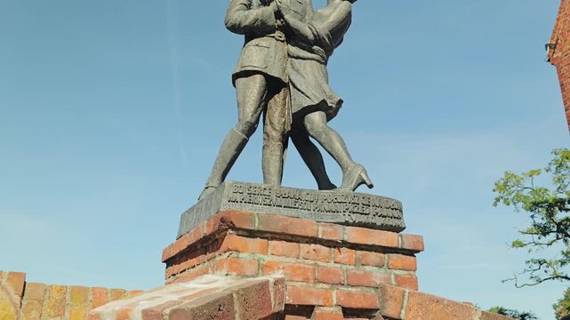 Bronze statue of soldier and girlfriend in Grudziadz Poland, history and love