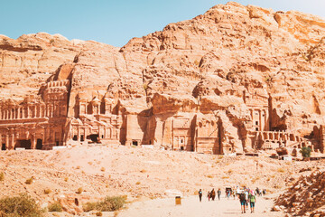 Tourists walk visit Petra historical landmark in Jordan on summer with scenic panorama of sacred...