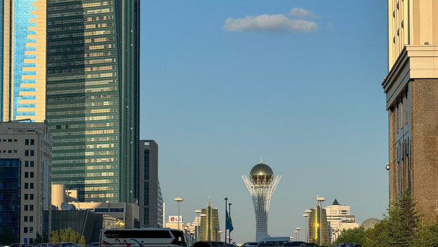Skyscrapers rise majestically, framing the futuristic Baiterek Tower under azure skies, celebrating Nauryz and architectural modernism in Astana 5 June 2025, Astana Kazakstan