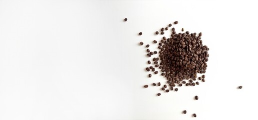 Coffee beans scattered on a white background, top view. Minimal banner template with empty space for text. Coffee background for advertising, cafe, restaurant, social media