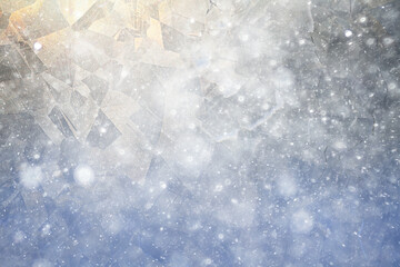 white winter background, frosty patterns on glass, abstract backdrop of ice and snow crystals in a blur