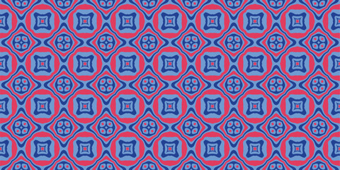 Fototapeta premium A repeating geometric pattern with blue and pink square motifs within diamond shapes creating an intricate mosaic aesthetic.