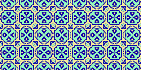 Obraz premium A repeating geometric pattern with a symmetrical arrangement of stylized floral motifs in shades of blue and light green on a cream background.