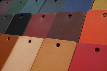 Various color samples of vegetable tanned cowhide leather swatch natural texture background