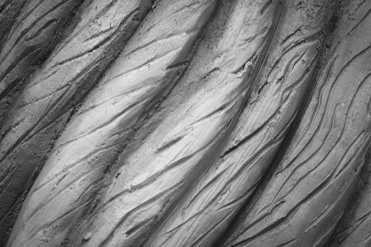 Fractured rock with angular shards and sharp crevices.