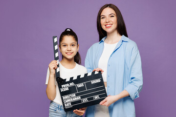 Young woman wear blue casual clothes with child baby girl 8-9 years old. Mommy little kid daughter...