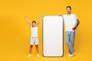 Full body young parent man with winner child girl wear casual blue pyjamas clothes. Daddy little...