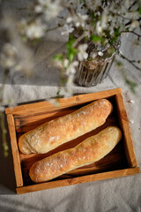 Homemade wholegrain baguettes baked for a spring breakfast. Wheat baguettes for breakfast.