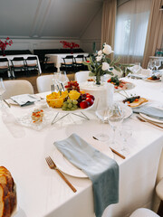 Elegant dining setup for a special event with fresh fruits and gourmet dishes
