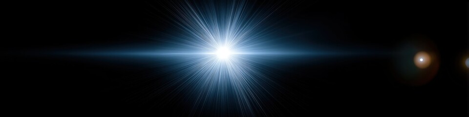 Bright blue starburst on black background with radiant light flare effect
