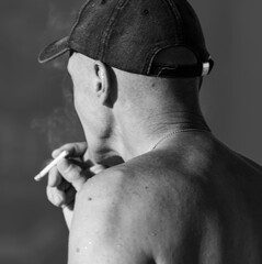 A man smoking a cigarette