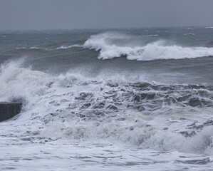 The ocean is rough with big waves