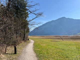Walking, sports and recreation trails around lake Lauerz (Lauerzersee) in the valley basin of Schwyz, Switzerland (Schweiz)