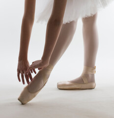 Young ballerina in white ballet tutu