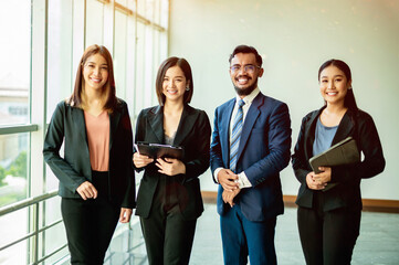 Happy teamwork among young entrepreneurs, teamwork, corporate growth goals and success in work.