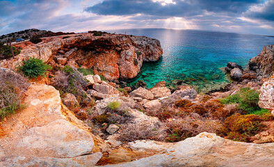 Panorama rocky coast Cape Greco, Cyprus, in morning. Famous site near Ayia Napa, Crow's Arch. Sunrise on Mediterranean island. © Tomasz