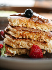Pancakes with berries and chocolate sauce