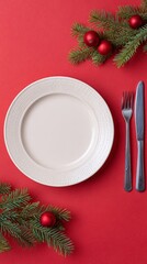 A pristine plate waits amidst festive fir and crimson baubles, echoing Yule and the Feast of Seven Fishes