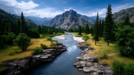 Obraz premium A wide aerial shot of a stunning braided river flowing through rocky sandbars and surrounded by green vegetation, distant trees, and hazy mountains.