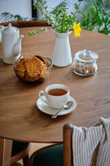Cups of hot tea on table