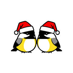 Fototapeta premium Two Chickadees Wear Santa Hats for Christmas
