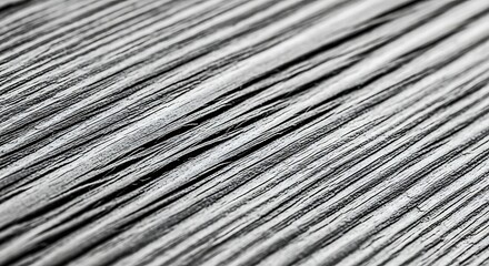 Fototapeta premium Abstract close-up of textured metallic surface with parallel lines and reflective properties.