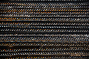 Close-up of stacked steel rebar rods used for construction reinforcement