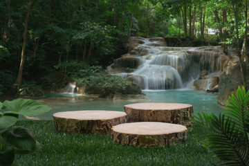 wood stump table top podium with outdoor waterfall tropical forest nature background landscape.Natural water mineral product present placement pedestal wooden stand display.jungle paradise concept.
