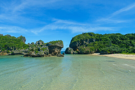 A clean small beach surrounded by natural reefs