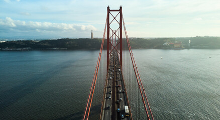 Aerial view of 25th April Bridge in Lisbon, Portugal. Famous landmark on river Tagus. High quality...