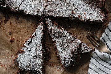 Gooey chocolate fudge cake (kladdkaka) on a baking paper