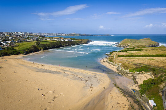 Surf and waves Mawgan Porth north Cornwall England near Newquay and south of Porthcothan and Treyarnon on a summer day with blue sk
