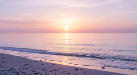 Tranquil sunrise paints the serene ocean with soft pastel hues, casting a peaceful glow on the sandy shore.