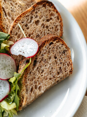Homemade bread with herbs and radishes