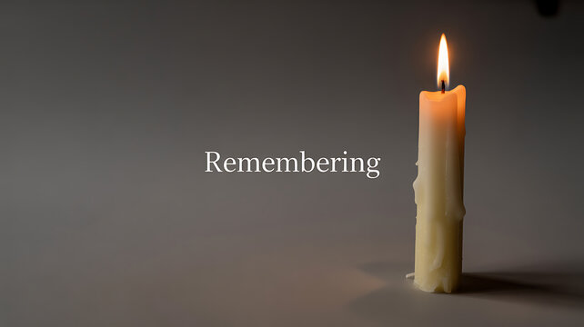 A single lit candle on a dark background with the word 'Remembering' displayed.