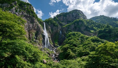 Lush mountain waterfall cascading down rocks