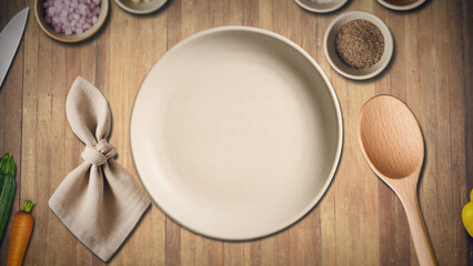 Top view of a rustic wooden kitchen table with empty plate, napkin, wooden spoon and fresh vegetables around, ready for food preparation in a cozy home cooking setting.