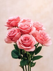 Obraz premium A vibrant bouquet of pink roses arranged elegantly against a soft, neutral background
