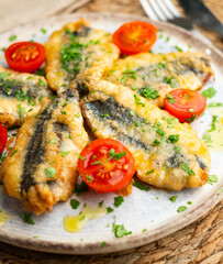 Spanish tapa of breaded anchovies in Malaga, Spain.