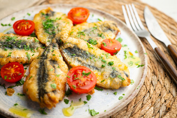 Spanish tapa of breaded anchovies in Malaga, Spain.