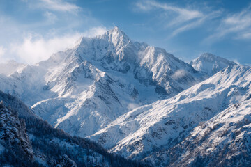 Snow-covered majestic mountain peak towering above surrounding ranges