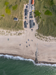 Aerial view directly above Stenbjerg, North Jutland, Denmark. Fishing village, sandy beaches, dunes, and the North Sea coastline, iconic summer landscape in Thy National Park