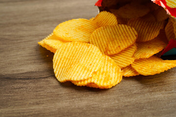 Potato chips in open bag, delicious BBQ seasoning spicy for crips, thin slice deep fried snack fast food.