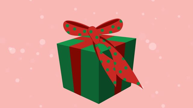 Christmas present with a polka dot bow appears and wiggles against a snowy pink background. Festive animation for holiday intros, celebrations, e-cards, or greetings.